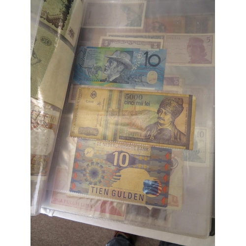 32 - A folder full of numerous world wide bank notes