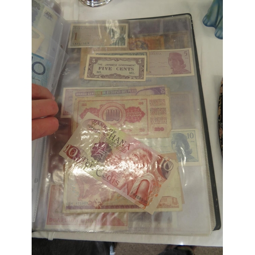 32 - A folder full of numerous world wide bank notes