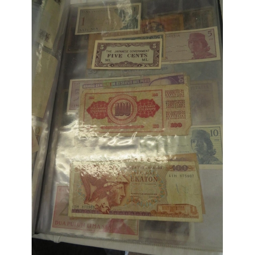 32 - A folder full of numerous world wide bank notes