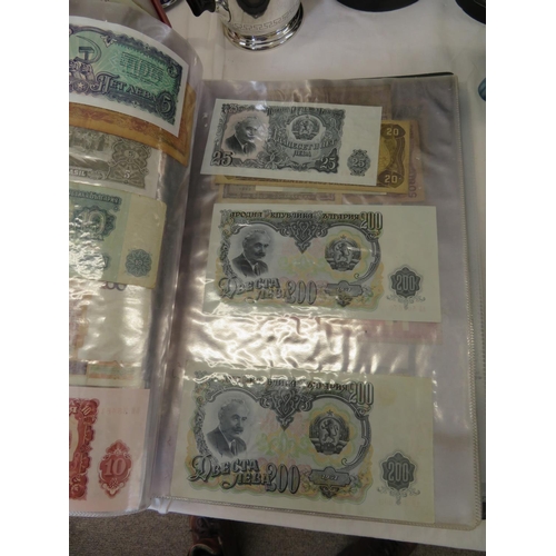 32 - A folder full of numerous world wide bank notes