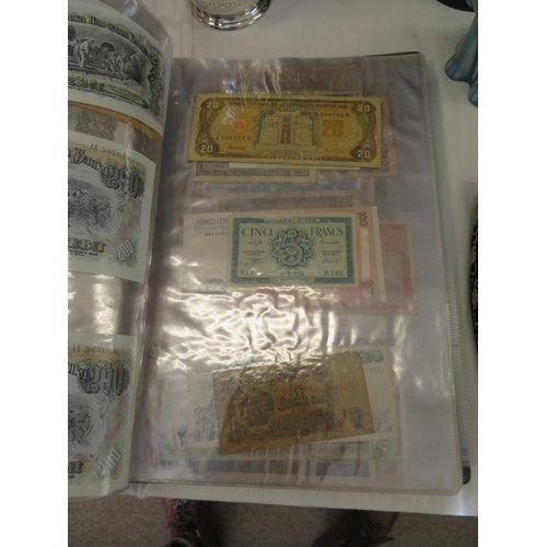 32 - A folder full of numerous world wide bank notes