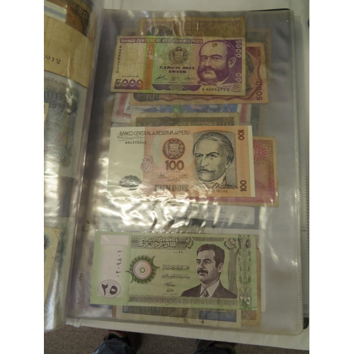 32 - A folder full of numerous world wide bank notes