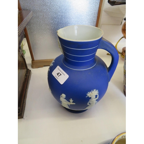 47 - Wedgwood dark blue Jasperware jug - ht. 8 ins