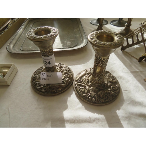 224 - Pair of loaded silver candle sticks, Birmingham 1968