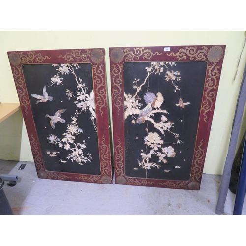 266 - Pair of Japanese red and black lacquered wall panels with mother of pearl and stone inlay decoration