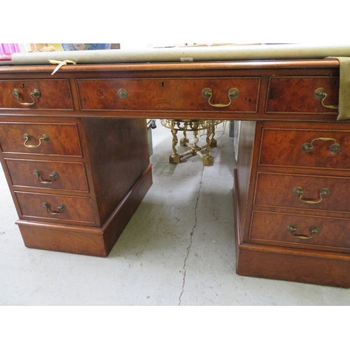 329 - Walnut veneered pedestal desk with nine drawers and tooled leather insert to top