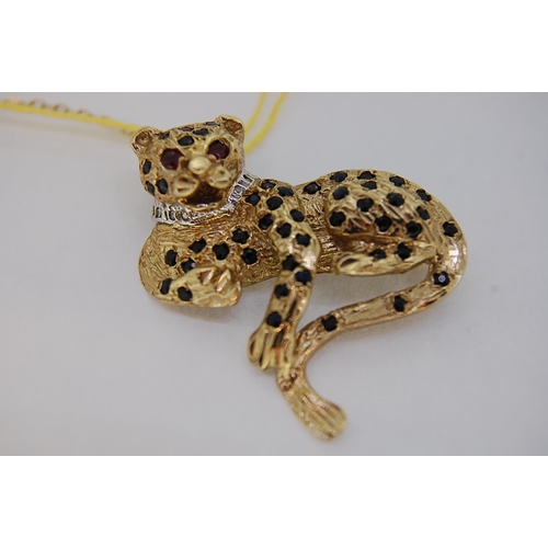 242 - 9ct gold leopard brooch with diamond collar, ruby eyes and sapphire spots, total weight 11.3 grams