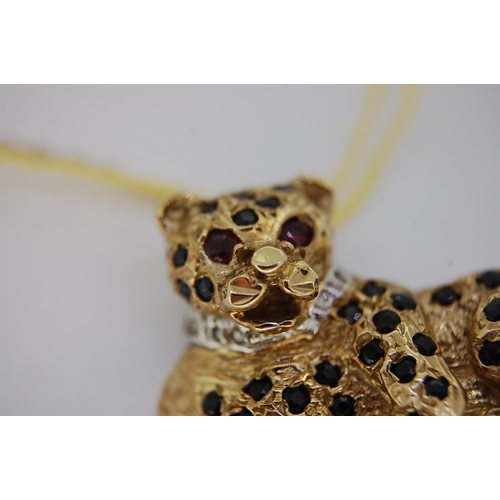 242 - 9ct gold leopard brooch with diamond collar, ruby eyes and sapphire spots, total weight 11.3 grams