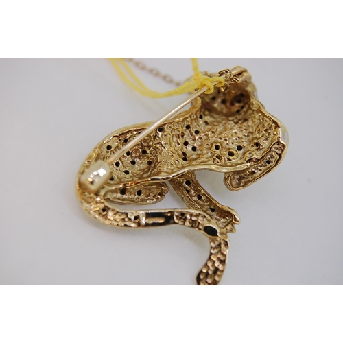 242 - 9ct gold leopard brooch with diamond collar, ruby eyes and sapphire spots, total weight 11.3 grams