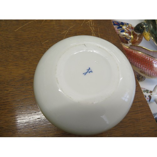 184 - A porcelain lidded bowl with crow decoration to top, crossed sword mark to base