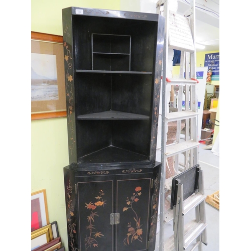 136 - Black Lacquered corner unit with floral decoration