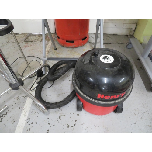 66 - Numatic Henry pull-along vacuum, coat stand and a floor lamp