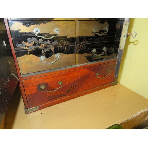 122 - Japanese small cabinet with seven drawers and metal furniture, marquetry inlay, black lacquered draw... 