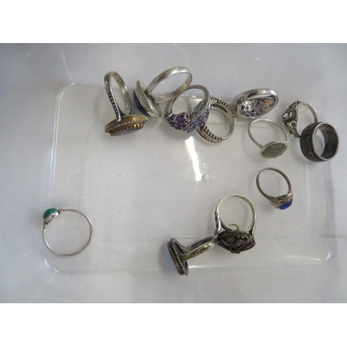 204 - Twelve silver and jewelled rings