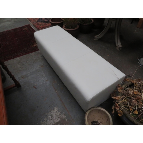 131 - Large cream leather footstool, length 58 inches x 19 inches