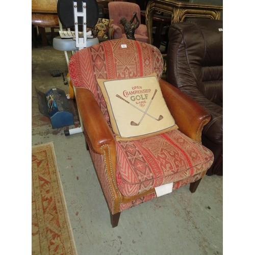 51 - Fireside chair with studded leather arms