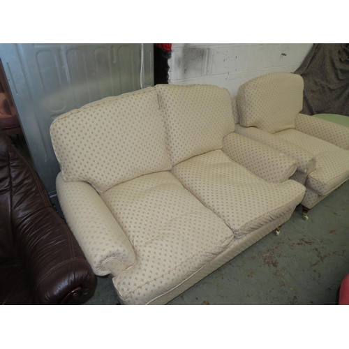 53 - Two seater settee plus matching chair in cream and gold upholstery plus a circular glass top table