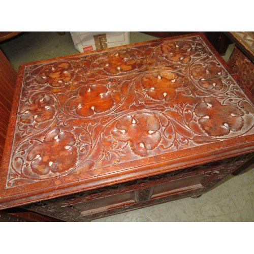 82 - Octagonal Far Eastern table on carved base and mother of pearl inlay, plus a storage box with carved... 