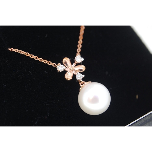 245 - 9ct Rose Gold Snowflake Style Diamond and Cultured Pearl Necklace