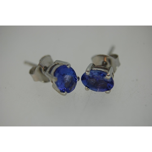 246 - A pair of Tanzanite ear studs set in silver