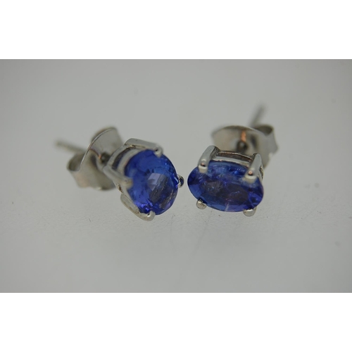 246 - A pair of Tanzanite ear studs set in silver