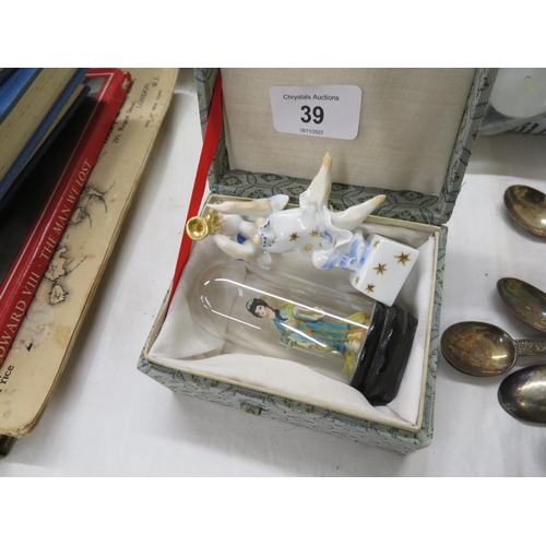 39 - A miniature Geisha model under glass together with a German porcelain Angel playing a trumpet