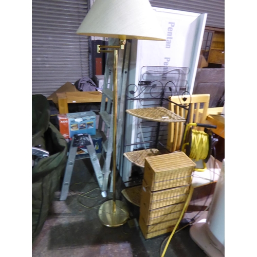 138 - Two wicker storage units and a standing lamp