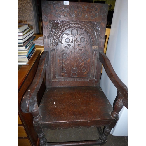 148 - Oak 18thC style high back heavily carved armchair