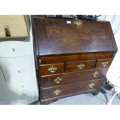 17 - Georgian oak fall front bureau with brass swing handles, brass locks on bracket feet