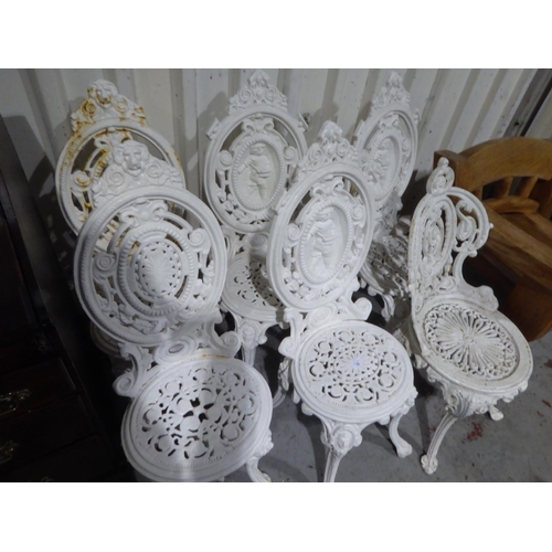 18 - Six cast iron garden chairs and table