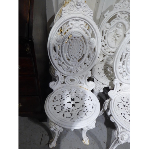 18 - Six cast iron garden chairs and table