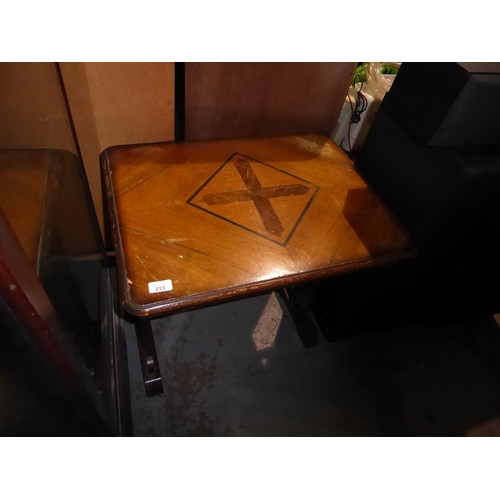 233 - Table with decoration of a cross to centre