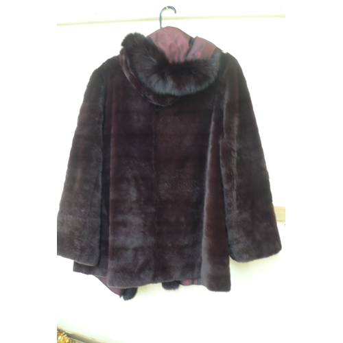 573 - Ladies reversible burgundy fur coat with hood and fur trim - size 14