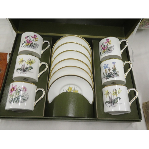 570 - Two Royal Worcester sets of six coffee cans and saucers with floral decoration, boxed plus a small p... 