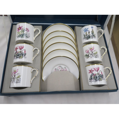 570 - Two Royal Worcester sets of six coffee cans and saucers with floral decoration, boxed plus a small p... 