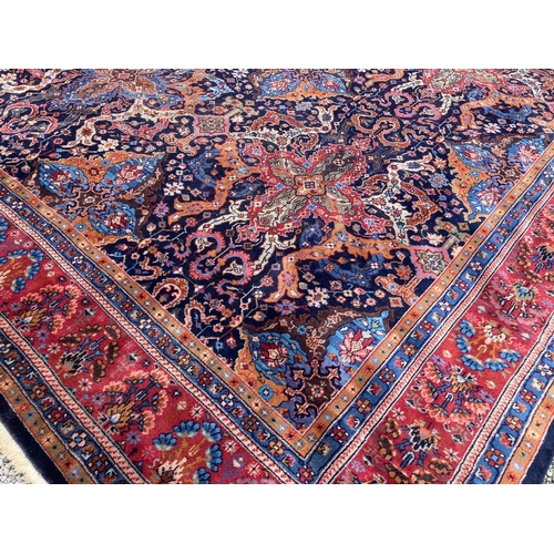 581 - Large hand-made Middle Eastern carpet with eight borders surrounding stylized floral and foliate des... 