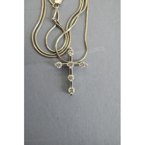 442 - 18ct White gold diamond cross on a rope chain, Total weight 5.7grms