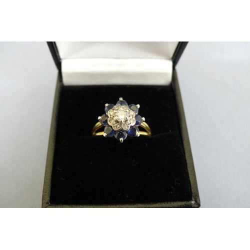 443 - An 18ct Gold Sapphire and Diamond Cluster ring (Tested), Size N