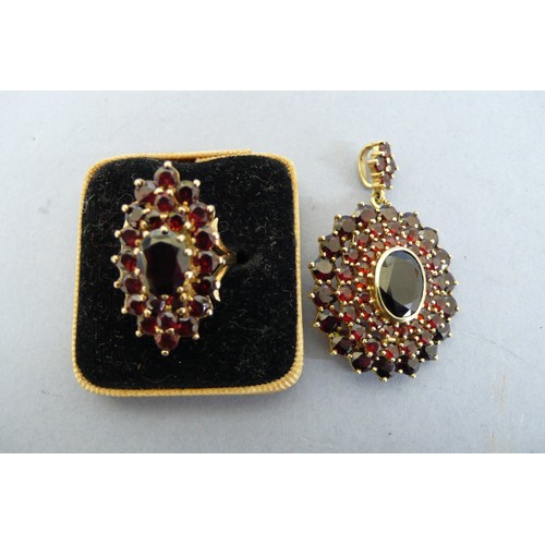 447 - 9ct gold multistone garnet pendant and ring. Size H/I