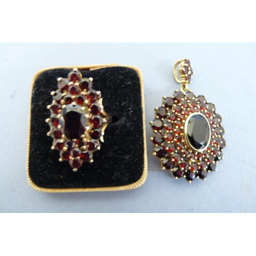 447 - 9ct gold multistone garnet pendant and ring. Size H/I