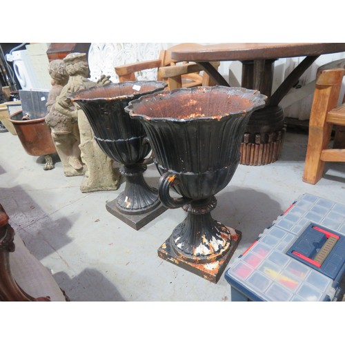 25 - Pair of quality cast iron urns, height 25ins (damaged)