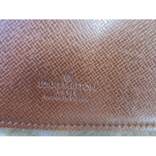 6 - Louis Vuitton leather wallet in monogrammed cover