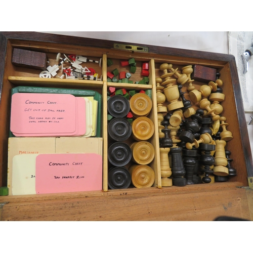 169 - Games compendium housed in a converted writing slope - Mah Jong, Monopoly, Chess, Dominoes etc