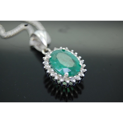 43 - 14ct white gold oval emeralds and diamond cluster pendant necklace