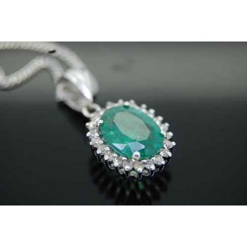 43 - 14ct white gold oval emeralds and diamond cluster pendant necklace