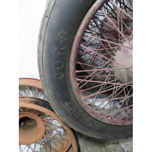 112 - Four 1930s Rolls Royce? wheels two with tires plus a spare tire holder