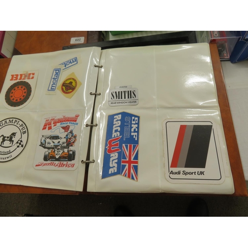 207 - An album of stickers and cloth patches relating to car racing