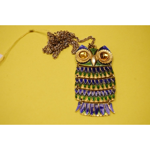 300 - Unusual costume jewellery articulated enamel and metal pendant in the form of an owl on a long chain