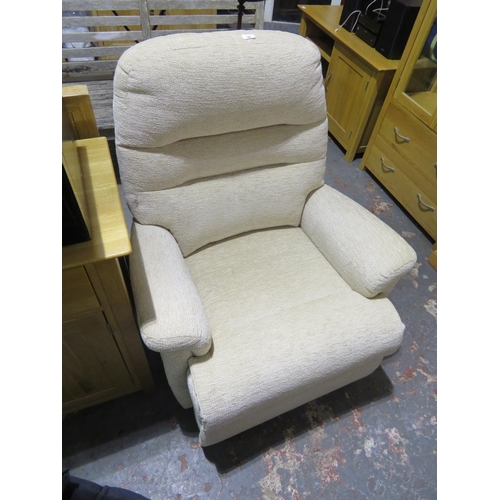 28 - Recliner chair in beige material with pull out leg rest