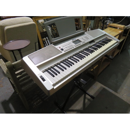 52 - Yamaha electric organ on folding stand, needs cables.